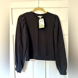 H&M black sweatshirt with floral accents on sleeves. Size small. New with tags!